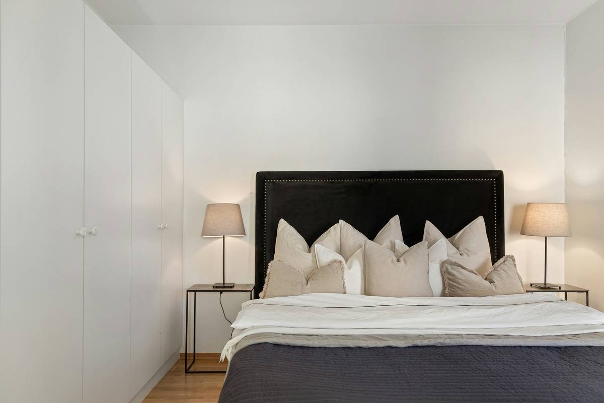 Why Your Bedroom Deserves a Black Canopy Bed with Nightstands (And How to Style It Right)