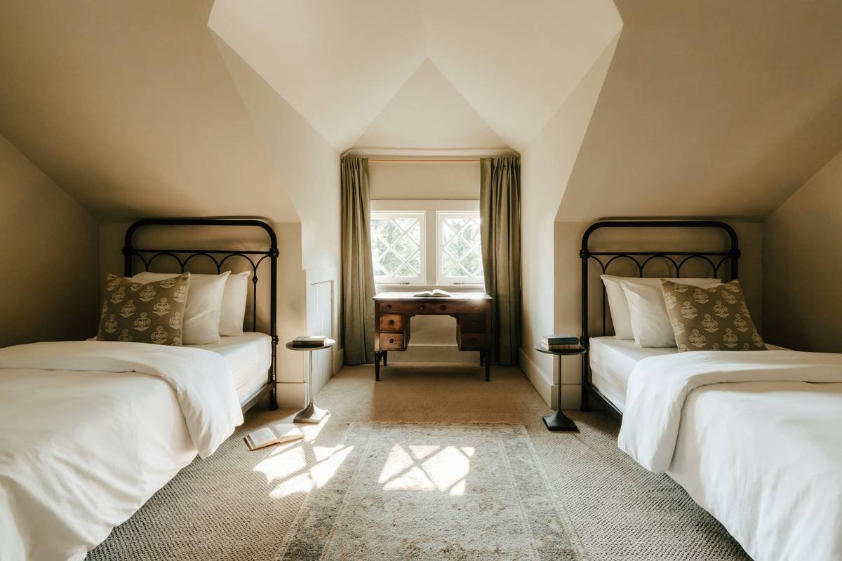 Canopy twin bed with nightstand showing proper spacing and functional layout