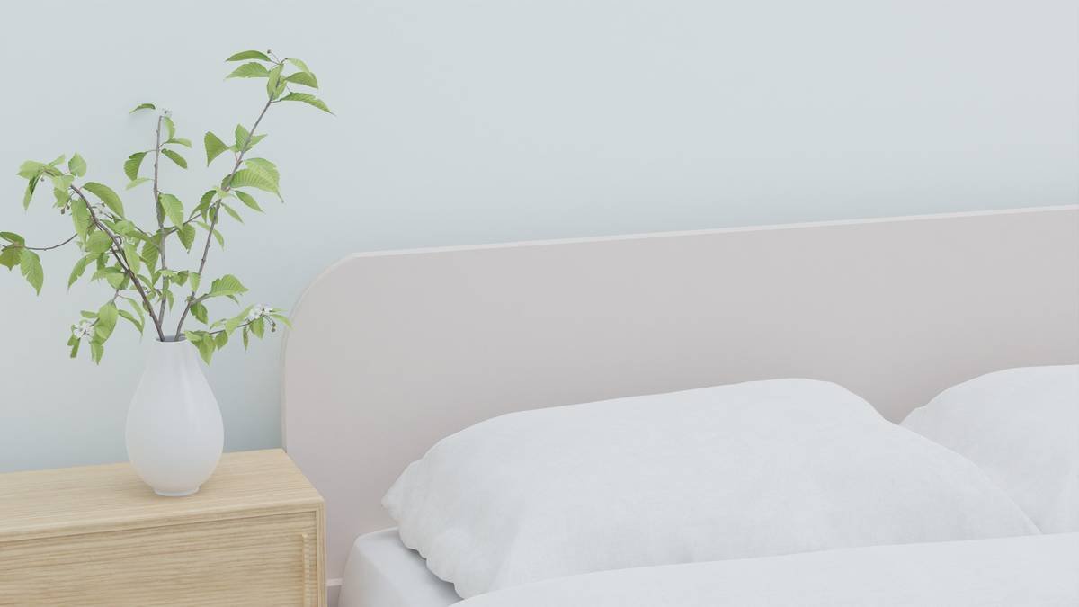 Diagram showing space savings of a canopy bed with built-in nightstands versus traditional setup in a 12x12 bedroom